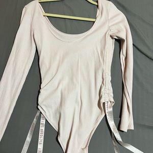 Pink Victoria’s Secret bodysuit